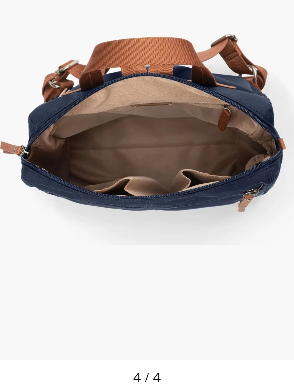 The Sak Navy Backpack with Brown Trim and Straps